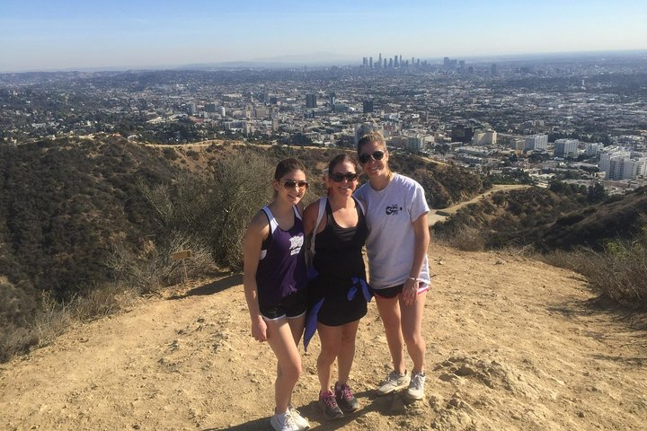Discover the beauty of Runyon Canyon where towering palm trees and stunning vistas blend with fun company creating an unforgettable outdoor experience in the heart of Los Angeles.